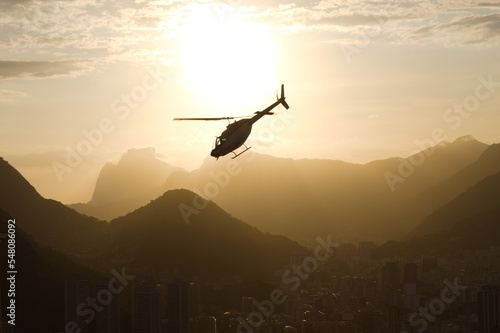 Helicopter at sunset with the mountains of Rio de Janeiro in the background