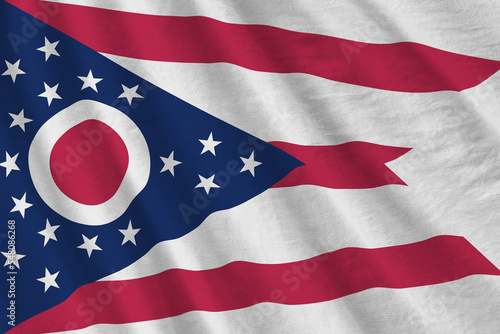 Ohio US state flag with big folds waving close up under the studio light indoors. The official symbols and colors in banner photo