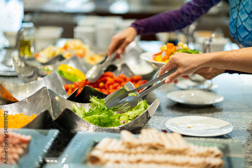 scooping the food, catering, dinner time