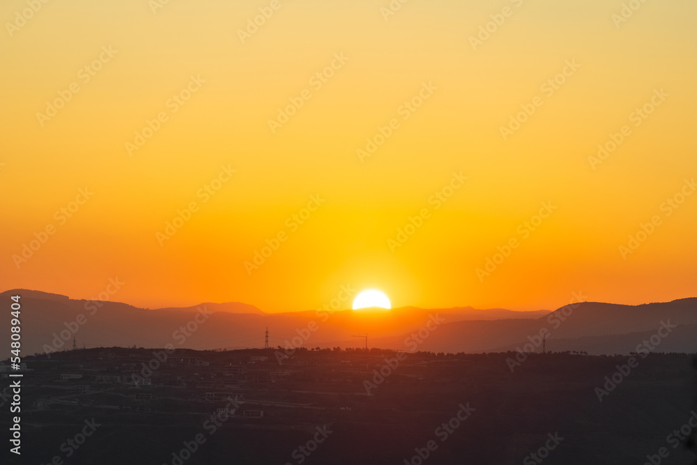 bright orange sunset over the mountains