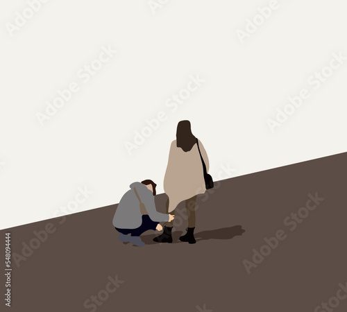 Man helping put shoes on or take off  on city street. Valentine day, couple relationship or romantic moment of lovers.