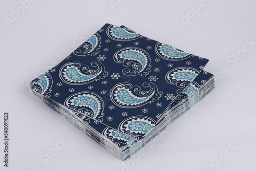 Patterned party napkins in a small stack