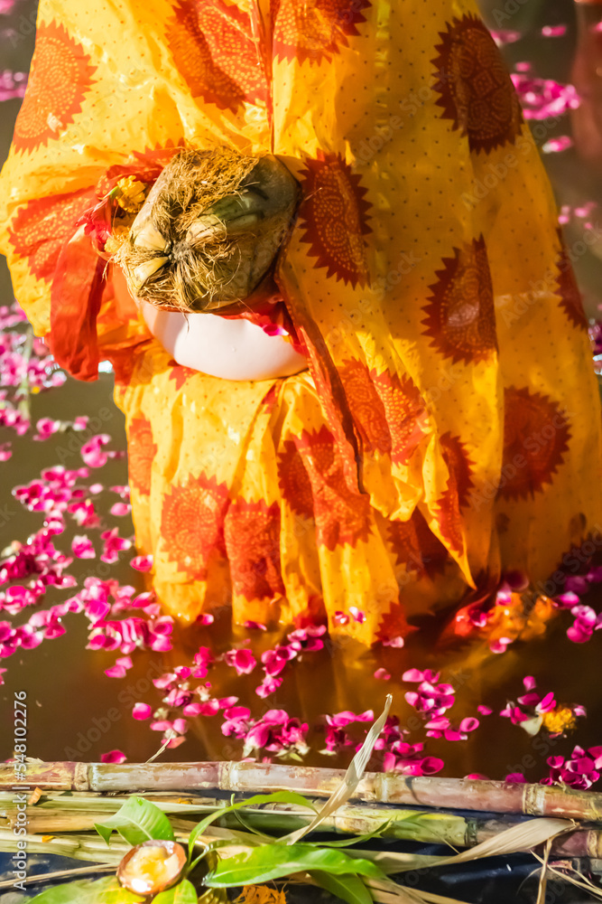 devotee religious offerings for sun god during Chhath festival from flat angle