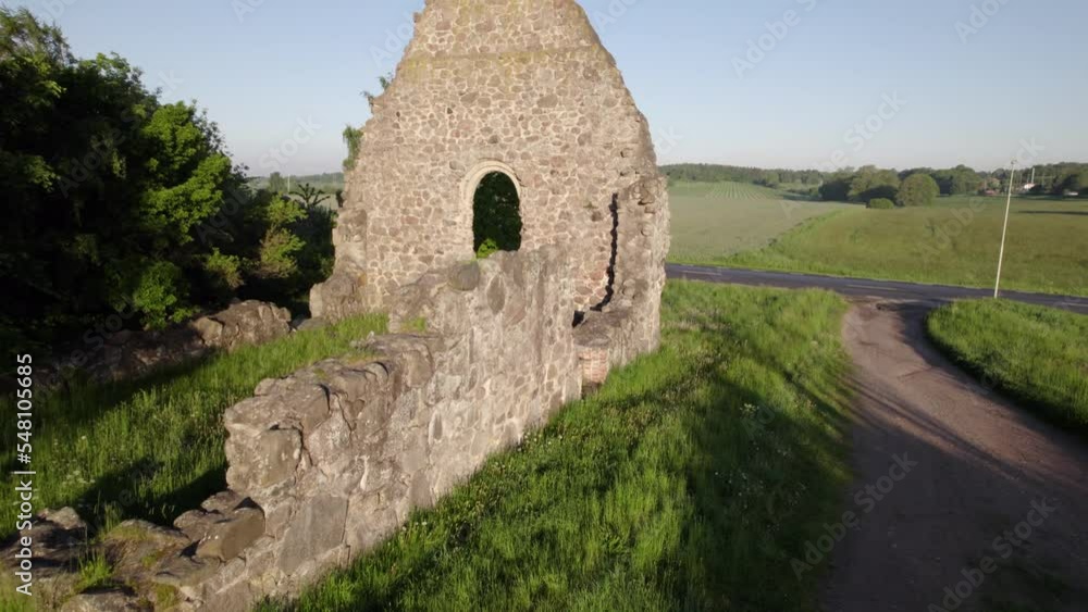 A ruin of an old chapel in Sweden during a summer morning. A ruin of an old chapel in Sweden during a summer morning.
