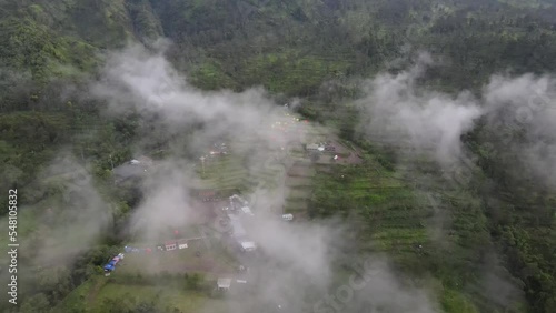 Aerial view of the slopes of Mount Merapi as seen from the Klangon Hill camping ground covered in clouds in the morning. photo