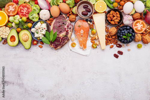 Ketogenic low carbs diet concept. Ingredients for healthy foods selection set up on white concrete background.