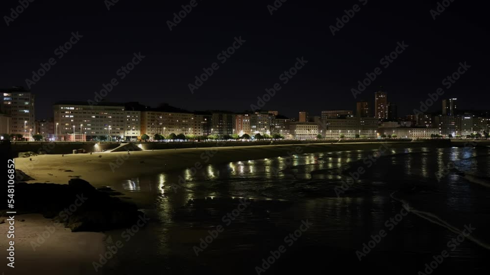 Night, city by the water, lots of illuminations to illuminate buildings and roads. Night, city by the water, lots of illuminations to illuminate buildings and roads.