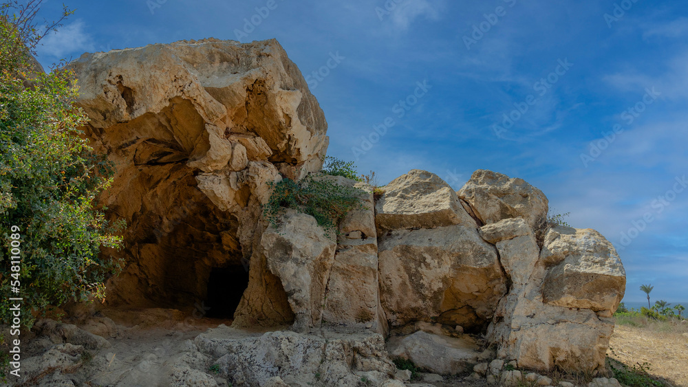 Big rock formation with ancient graves, Tombs of Kings, Paphos, Cyprus