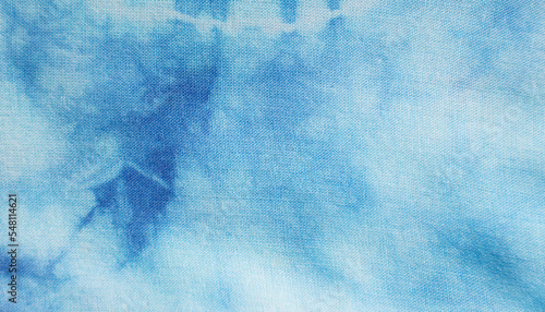 Close up of dye indigo fabric background in blue and white. Natural texture pattern for textile design.
