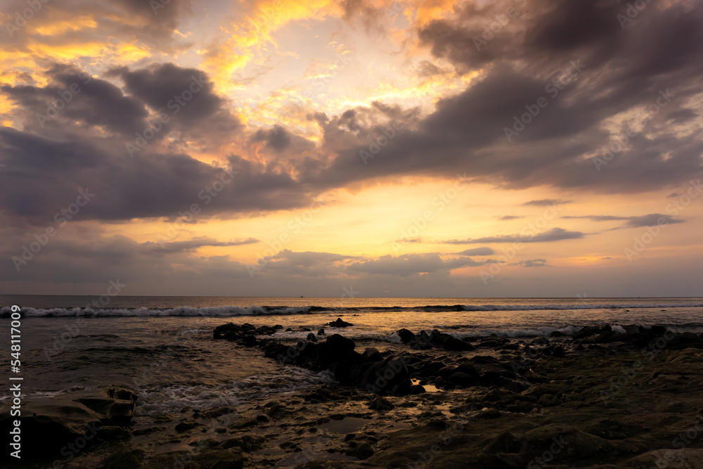 Lombok sunset with colour background.(soft focus, shallow DOF, slight motion blur)