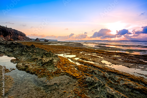 Sunset at Ekas Beach Lombok island, Indonesia. Beautiful stone structure and Unit 