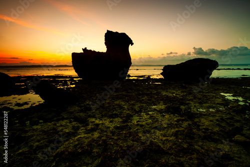 Sunset at Ekas Beach Lombok island, Indonesia. Beautiful stone structure and Unit 