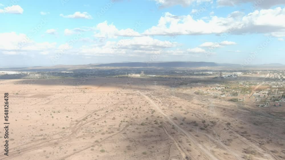 high bird's eye view of a city on the edge of an inhospitable desert area. wide shot high bird's eye view of a city on the edge of an inhospitable desert area. wide shot