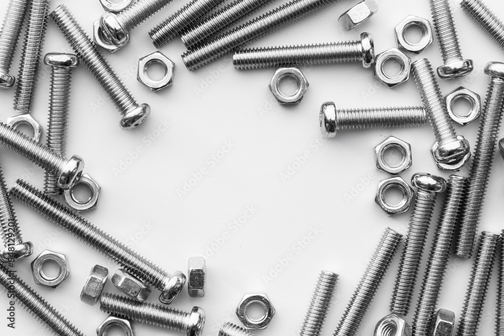 Nuts / Bolts / Screws closeup on white background Nuts / Bolts / Screws closeup on white background