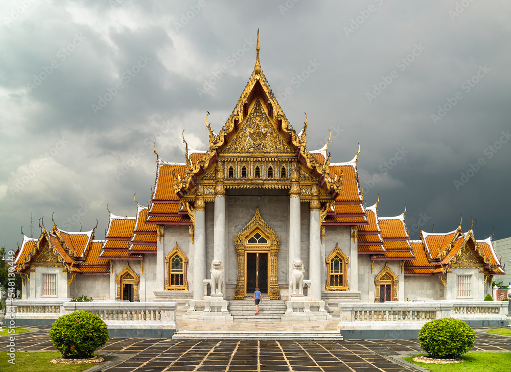 woman entering at Thai Marble temple or Wat Benchamabophit, Bangkok