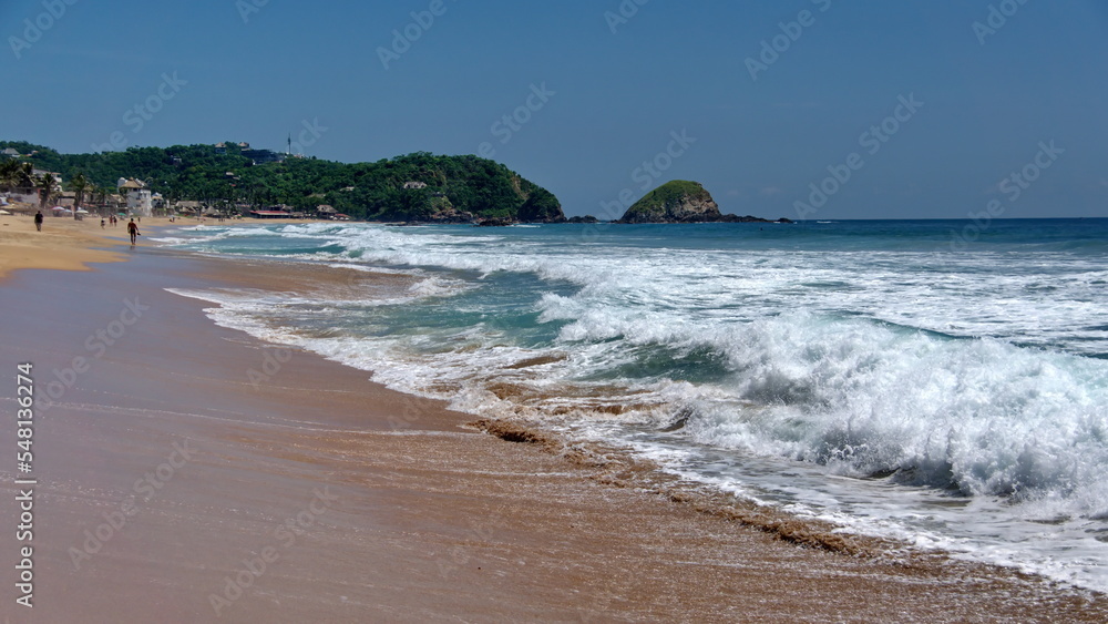 Waves breaking on the beach in Zipolite, Mexico
