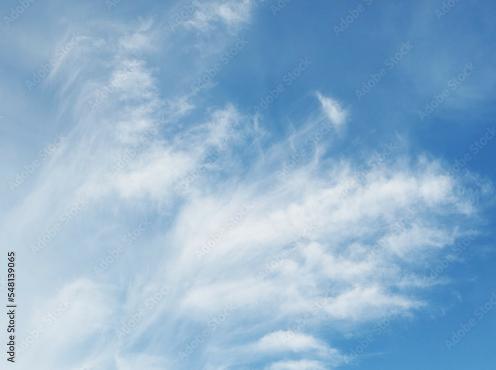 Spectacular cirrus clouds over Thailand, Blue Sky and Wispy Clouds that these clouds look really thin and wispy. It almost like someone painted a white-colored stroke on a blue canvas.