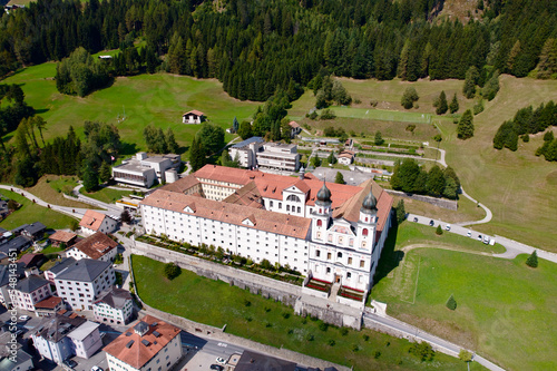 Aerial view of Cloister Disentis, Canton Graubünden, at alpine village in the Swiss Alps on a sunny late summer day. Photo taken September 5th, 2022, Disentis, Switzerland. photo