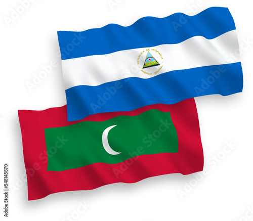National vector fabric wave flags of Nicaragua and Maldives isolated on white background. 1 to 2 proportion.
