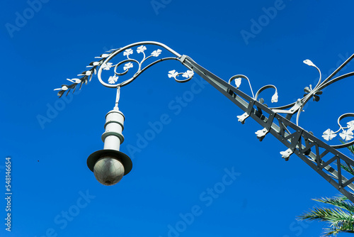 Photography Beautiful modernist street light typical from Barcelona cityscape with a blue sk
