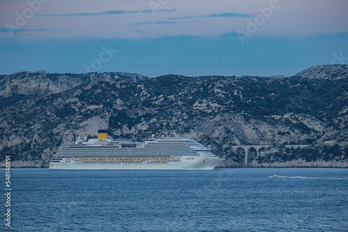 Costa cruiseship or cruise ship liner Diadema arrival into Marseille Provence port during sunrise twilight blue hour Mediterranean cruise dream vacation 