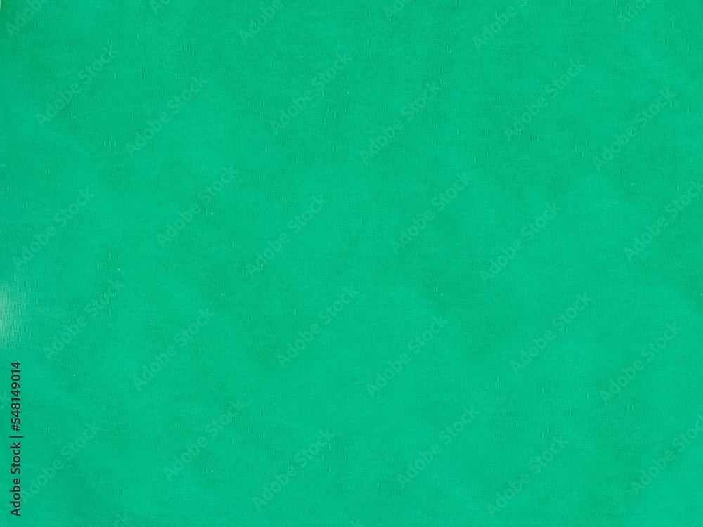Green linen fabric texture close-up of natural cotton decorative canvas background Green linen fabric texture close-up of natural cotton decorative canvas background