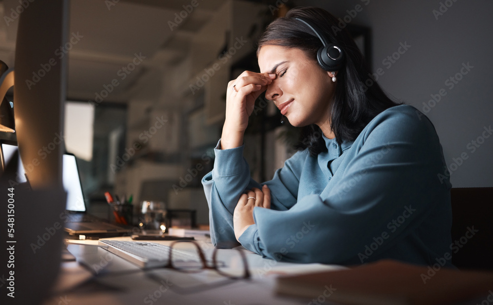 Stress, burnout and overtime, woman in call center with headache at crm office desk. Tired, frustrated and annoyed customer service consultant at computer working late at night with error or glitch. Stress, burnout and overtime, woman in call center with headache at crm office desk. Tired, frustrated and annoyed customer service consultant at computer working late at night with error or glitch.