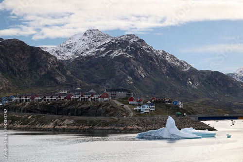 Large iceberg in the bay of the small Greenlandic town of Sisimiut, Greenland, Denmark   photo