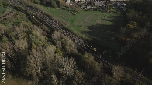 Aerial shot of a moving draisine or speeders. Drone tracking shot from above. photo