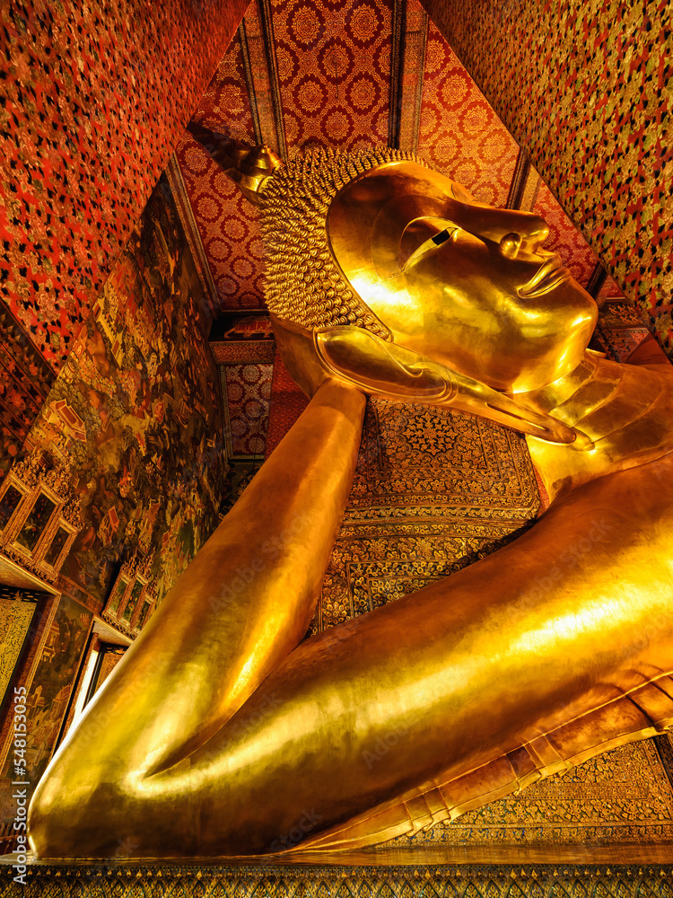 famous golden reclining buddha statue at wat pho in Bangkok Thailand