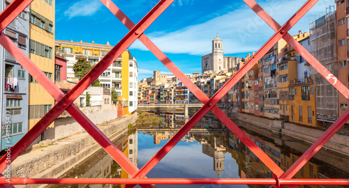 Girona city red famous bridge, colourful houses and river- Catalonia in Spain