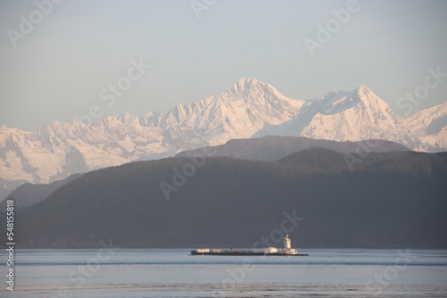 Ship sailing near the Inian Islands, Alaska, USA. photo