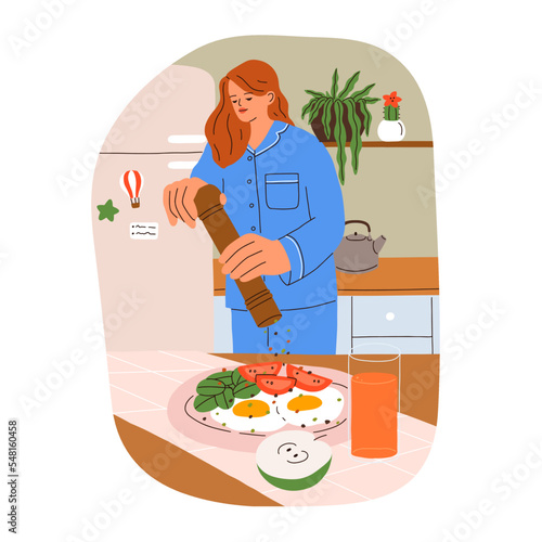 Girl cooking breakfast at home kitchen. Young woman makes, cooks morning food...