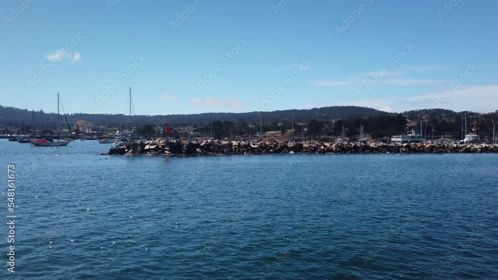 Gimbal wide shot approaching the breakwater on a boat at the Port of Monterey in Monterey, California. 4K Gimbal wide shot approaching the breakwater on a boat at the Port of Monterey in Monterey, California. 4K