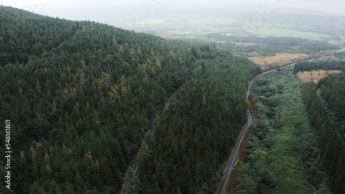 Aerial top view of two forest roads in the Clogheen mountains with the camera panning up, Tipperary, Ireland. photo