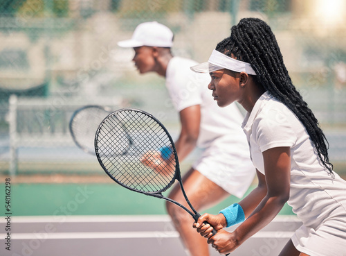 Tennis, team sport and black woman with partner on court for fitness, exercise and sport competition or game training for a club. Athlete girl and man outdoor for exercise, action and workout © L Ismail/peopleimages.com