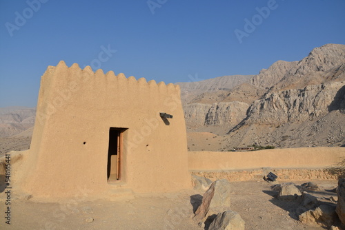 Dhayah Fort, a castle-like structure, is on the UNESCO World Heritage Tentative List and stands proud amidst the arid mountains, United Arab Emirates, Ras Al Khaimah. photo