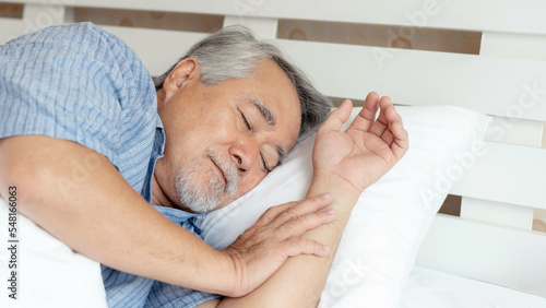 Senior male , old man  sleeping on bed in the morning - lifestyle senior male concept