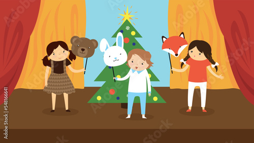 Foto Children at the matinee near the Christmas tree in carnival masks