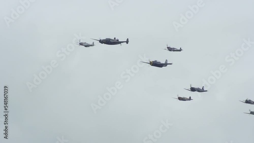 World War 2 bombers & fighter planes fly in formation