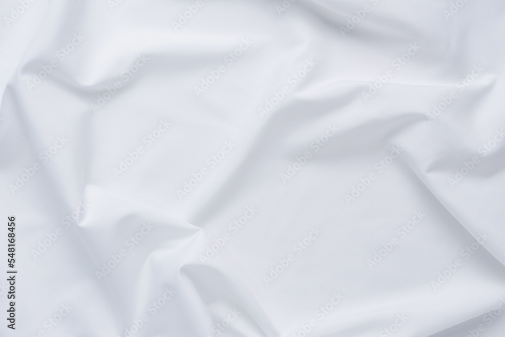 White fabric. luxurious white fabric texture background. Creases of satin, silk, and cotton..