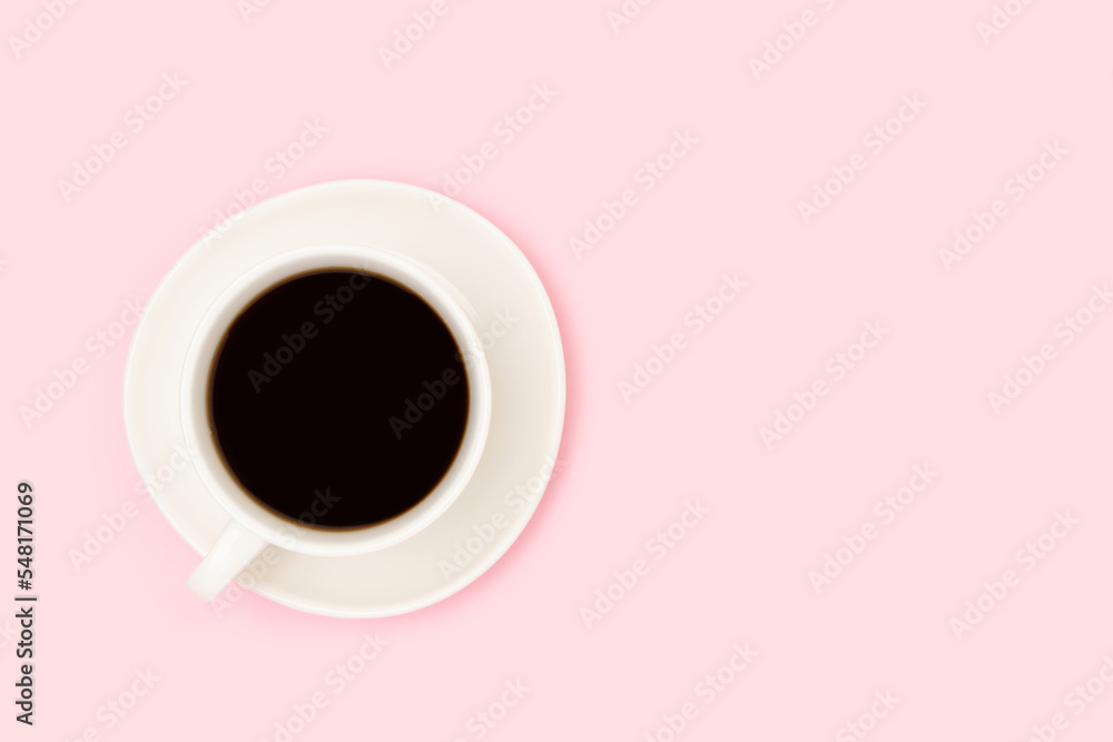 Cup with black coffee on a pink background. Minimal composition with copy space. Cup with black coffee on a pink background. Minimal composition with copy space.