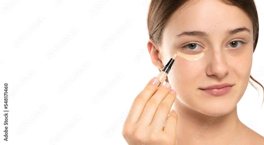 Woman applying concealer on flawless fresh skin, doing make up. Girl put corrector under eye area. Woman applying concealer on flawless fresh skin, doing make up. Girl put corrector under eye area.