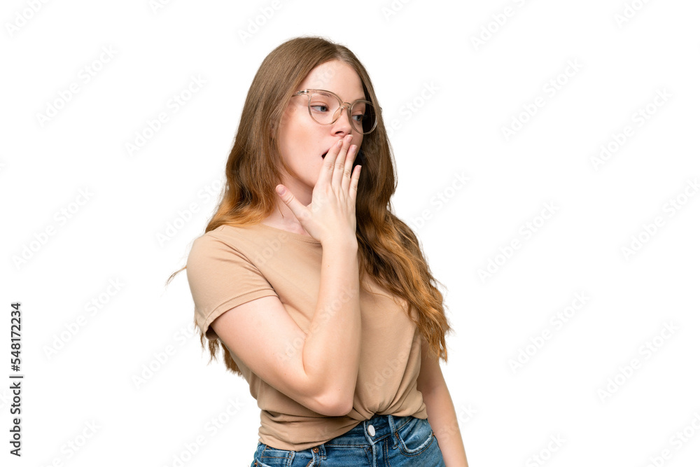 Young pretty woman over isolated background yawning and covering wide open mouth with hand Young pretty woman over isolated background yawning and covering wide open mouth with hand