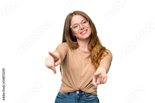 Young pretty woman over isolated background pointing front with happy expression