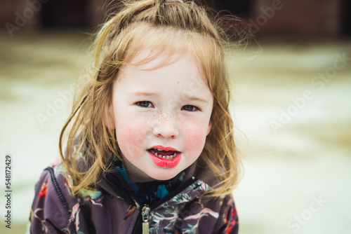 Obraz na płótnie Highly sensitive, beautiful young boy child with long blond hair and colorful birds and trees jumpsuit out in nature. w salonie