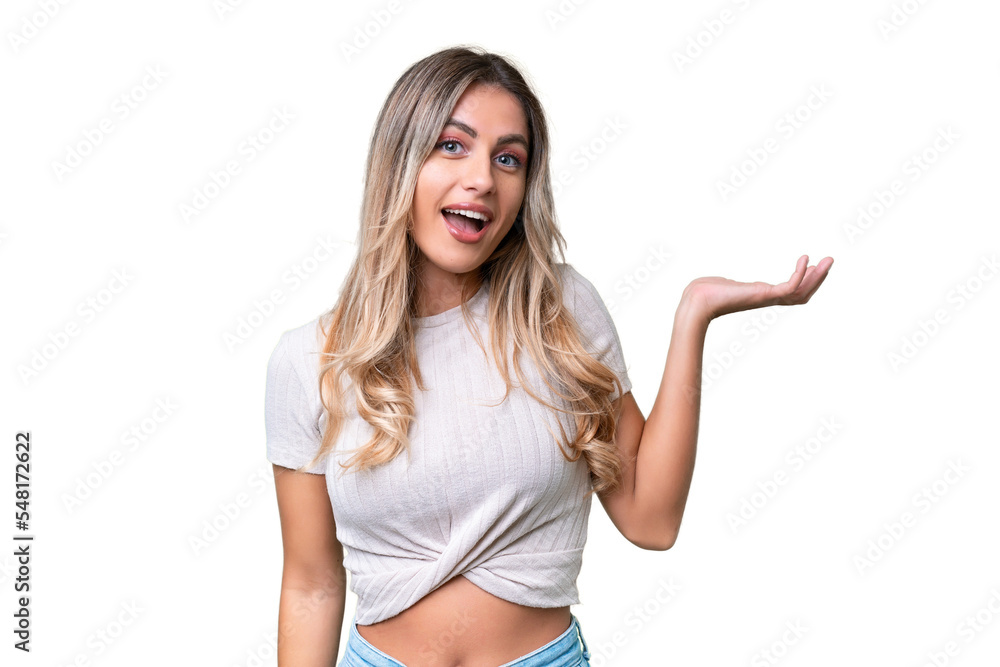 Young Uruguayan woman over isolated background making doubts gesture Young Uruguayan woman over isolated background making doubts gesture
