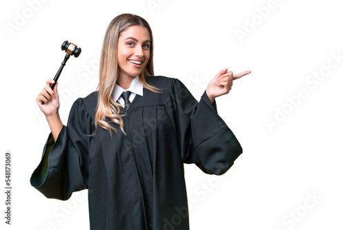 Judge Uruguayan woman over isolated background pointing finger to the side photo