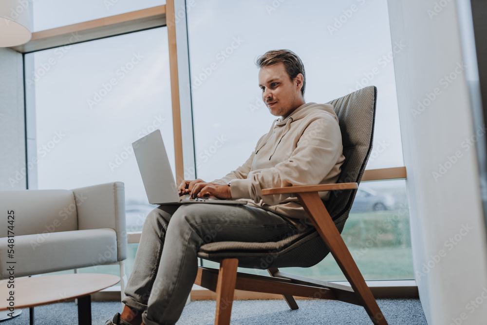young business man is writing on a notebook, he is busy and working hard in his home office because of the covid pandemic