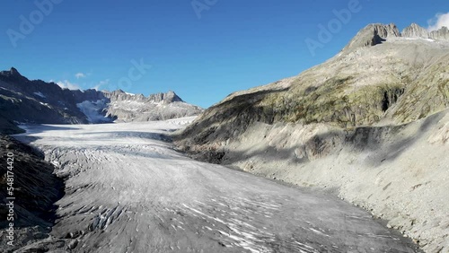 Wallpaper Mural Aerial view of Rhone glacier near Furka mountain pass at the border of Valais and Uri in Switzerland with a pan down from the mountain peaks over the ice down to the iceberg filled lake Torontodigital.ca